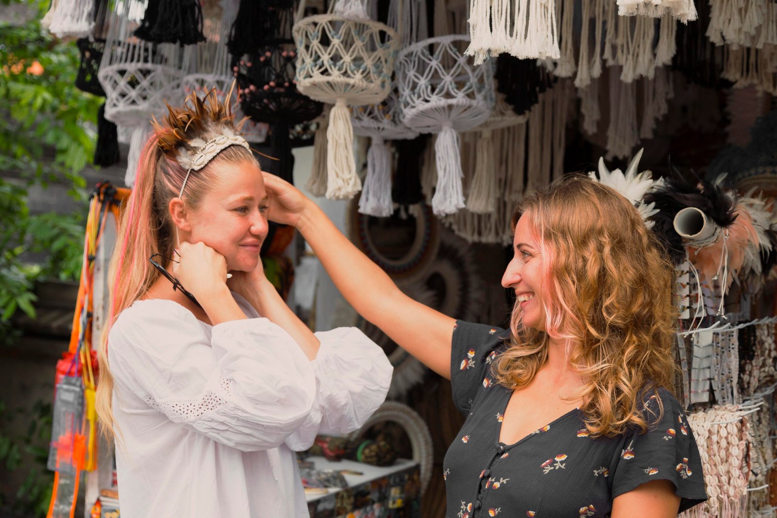 two female friends having fun flea market
